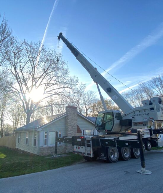 heartland tree services white crane truck